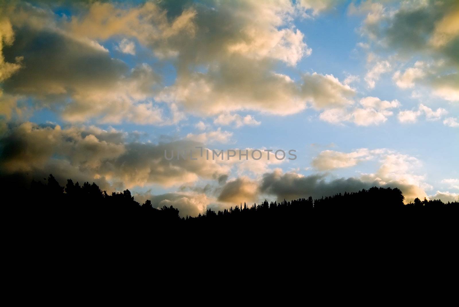 clouds and mountain silhouette by noam