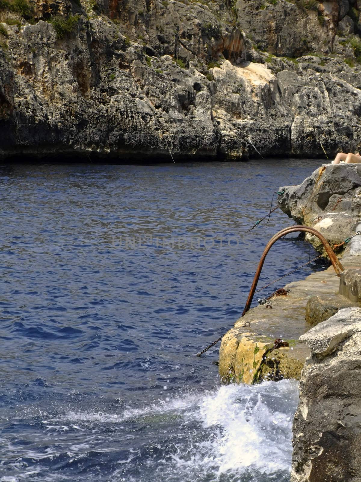 Typical rocky coastline in Malta, punctuated with sheer drops and jagged cliffs