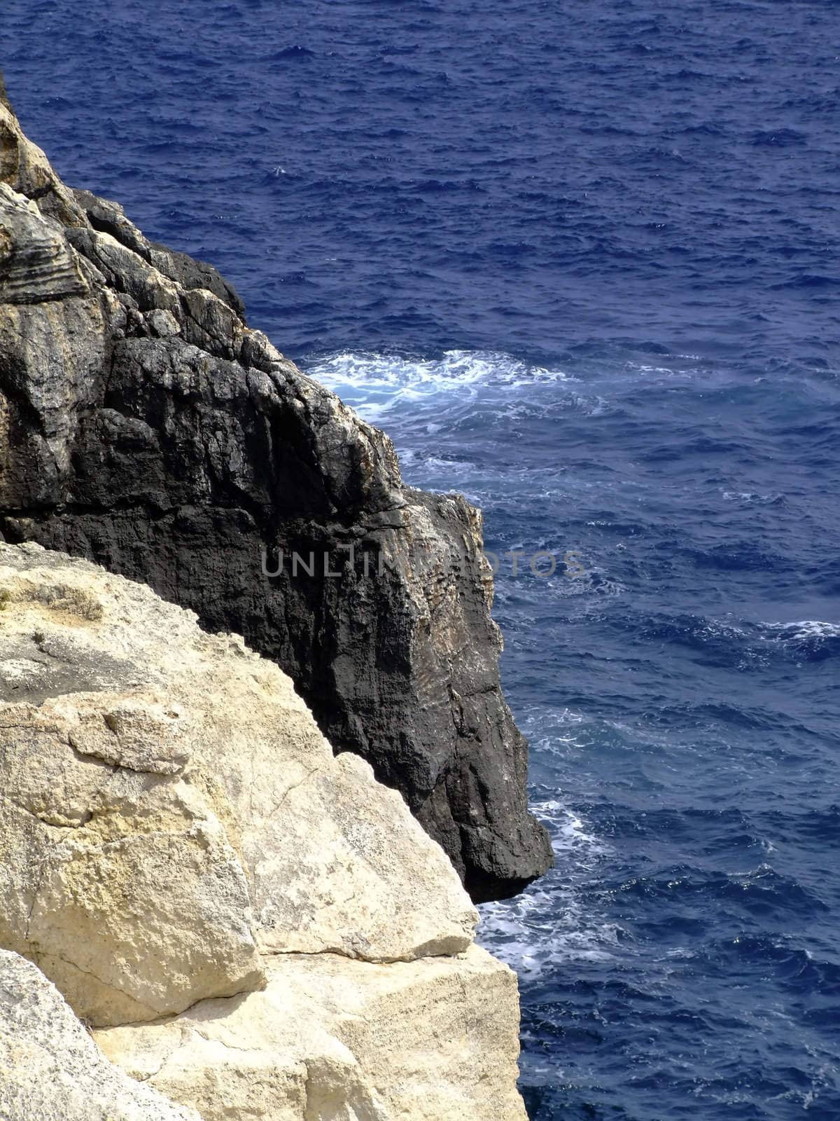 Typical rocky coastline in Malta, punctuated with sheer drops and jagged cliffs