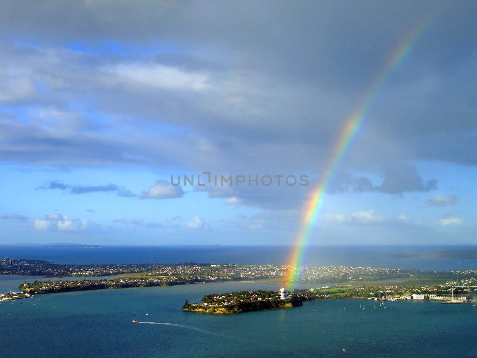 Rainbow over Stanley Bay, Auckland, New Zealand by Cloudia