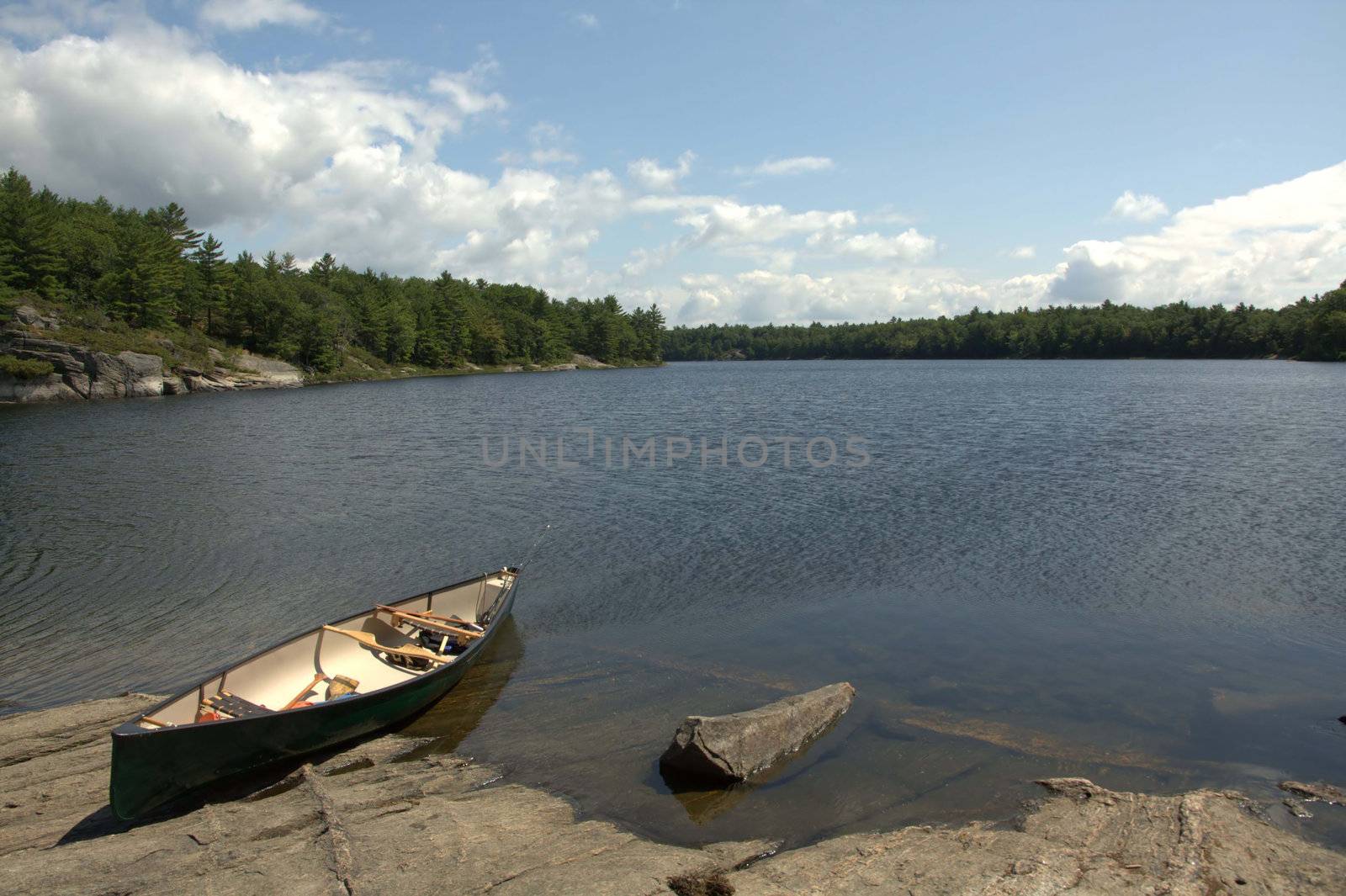 An image of a canoe in the Honey Harbour area of Georgian Bay, on a beautiful sunny day.
