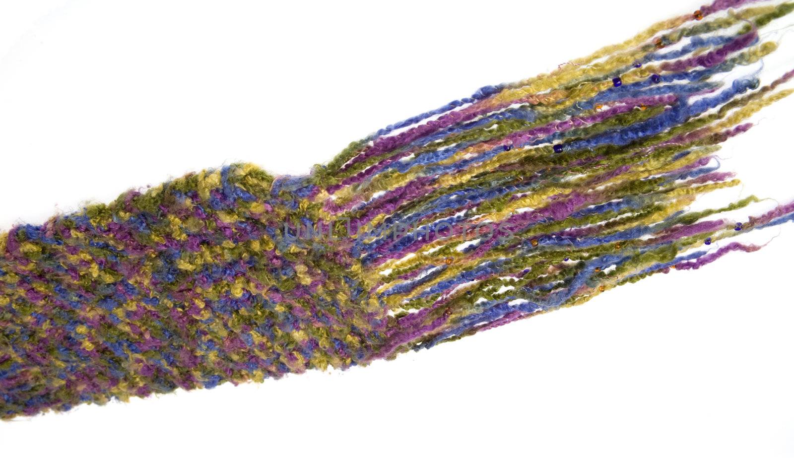 A colorful fringed shawl  isolated over white.