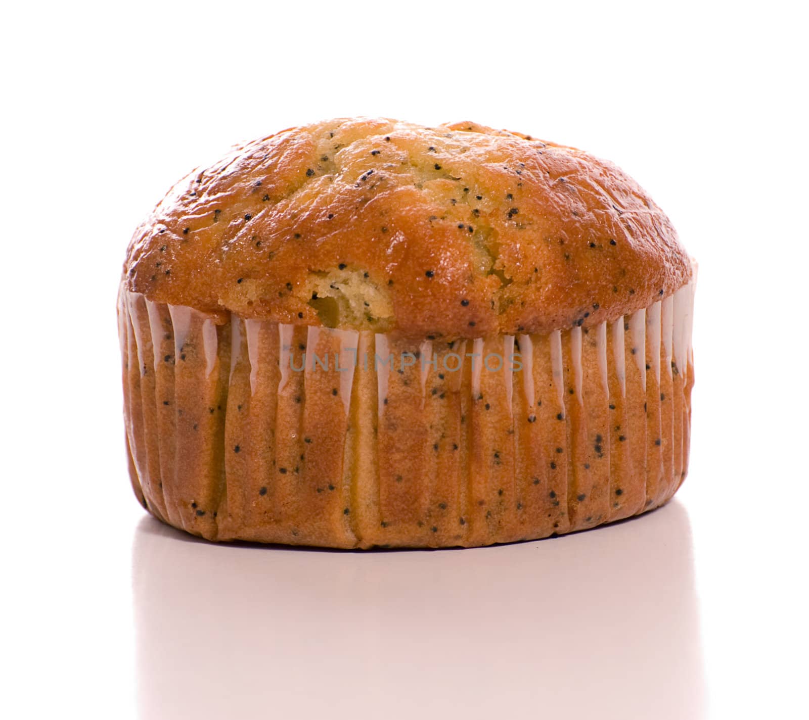 Closeup view of a carrot muffin shot against a white background