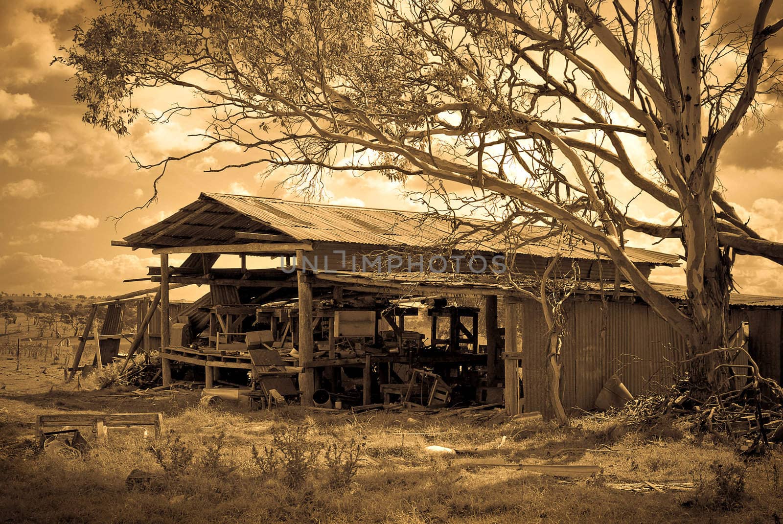 an old farm shed and equipment falling down