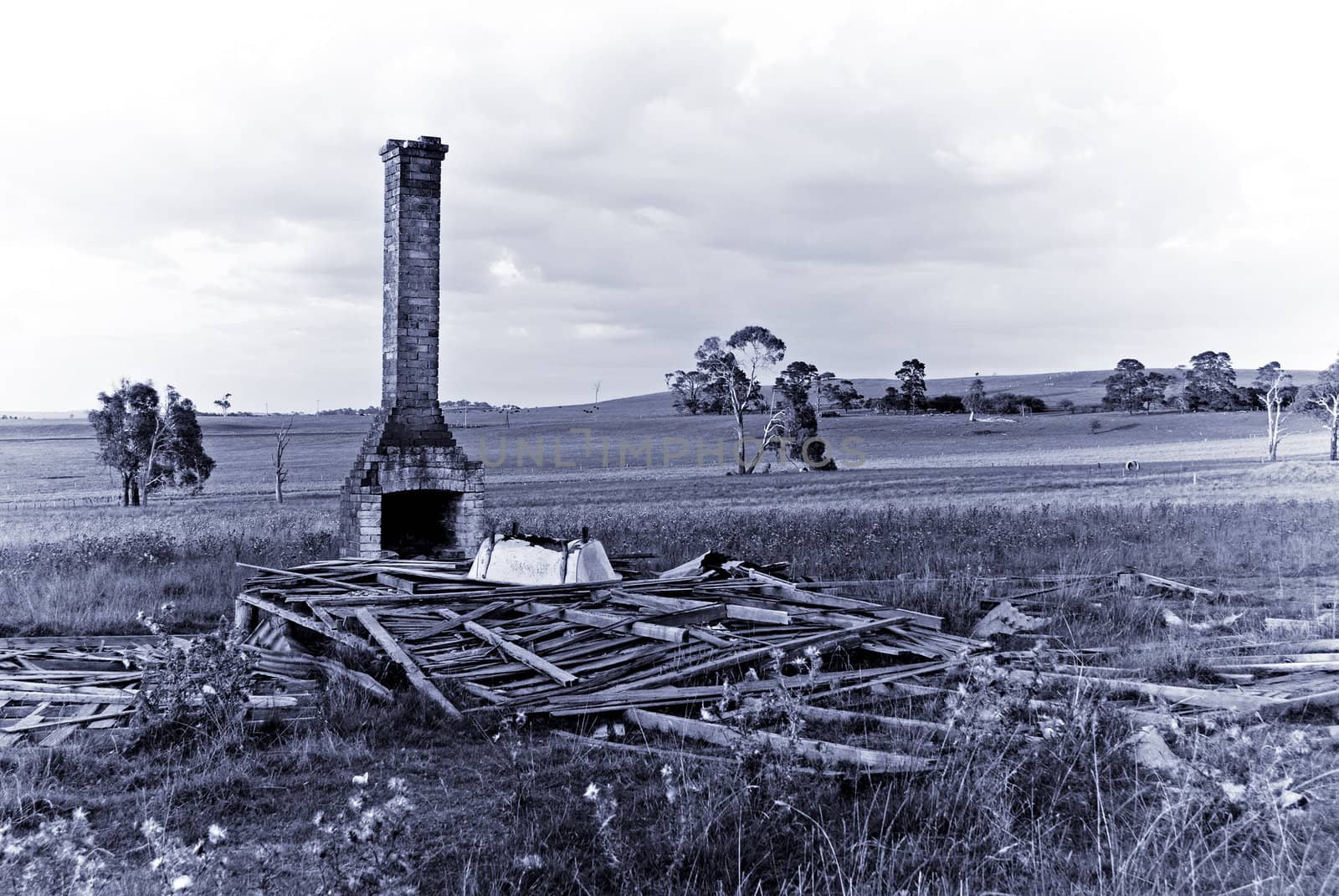 a purple tone image of old ruins of a farmhouse symbolising the past and days gone by