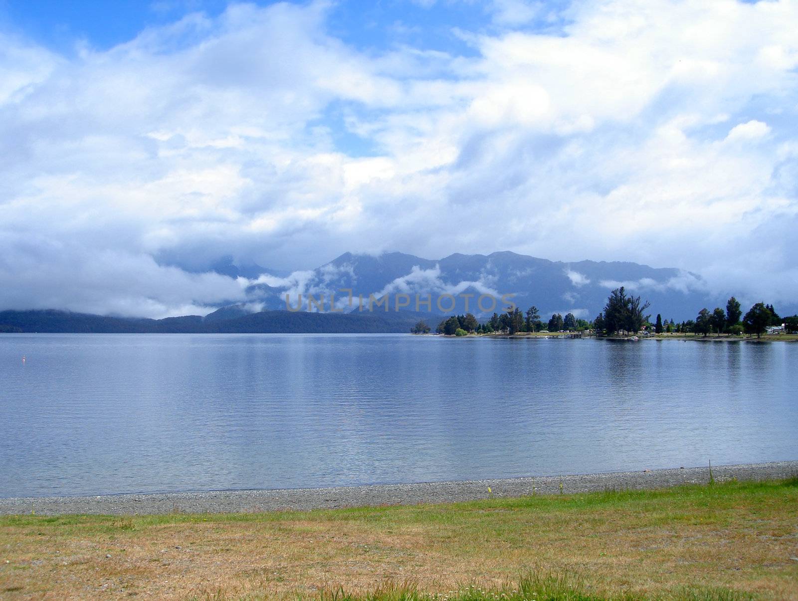 Misted Mountain behind Lake Te Anau, New Zealand by Cloudia