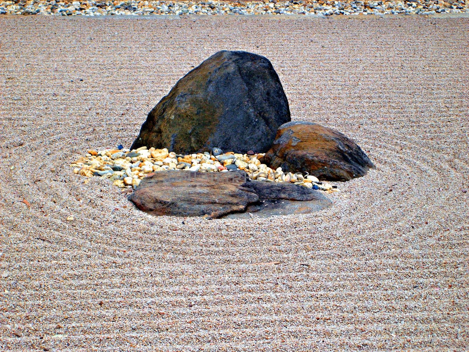 Karesansui - Sea of Sand - Japanese dry rock garden intended to evoke the vastness of sea with its islands and continents.