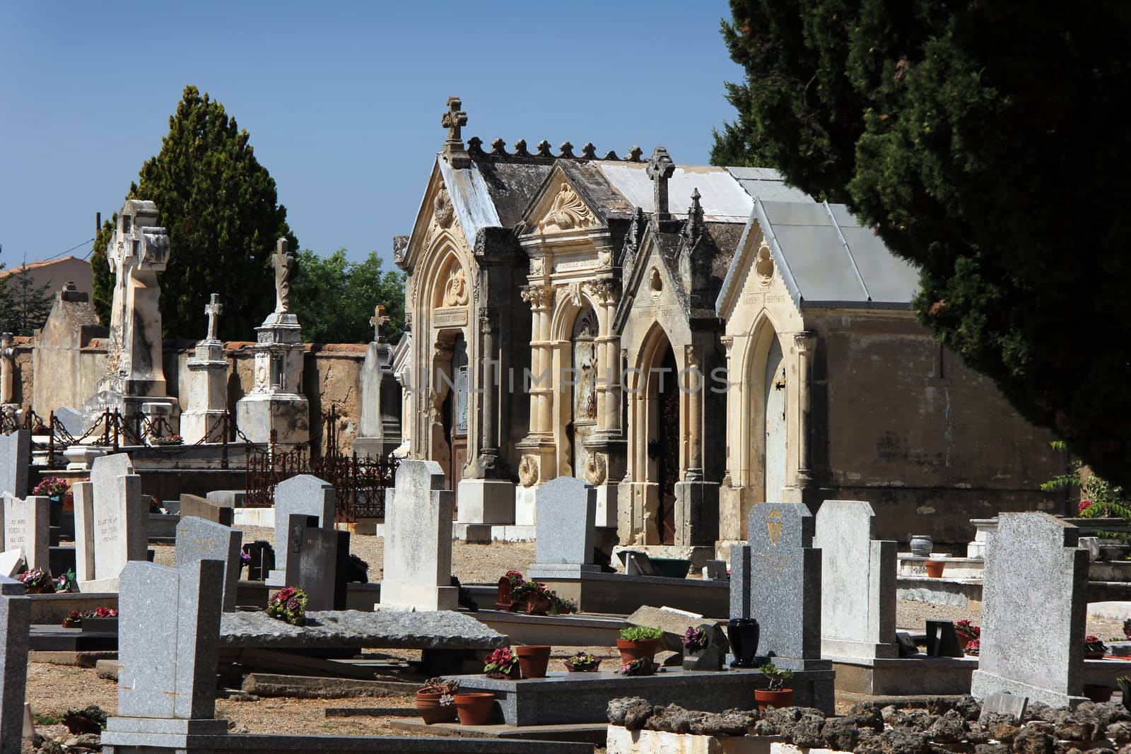 old mediterranean graveyard with large stone graves