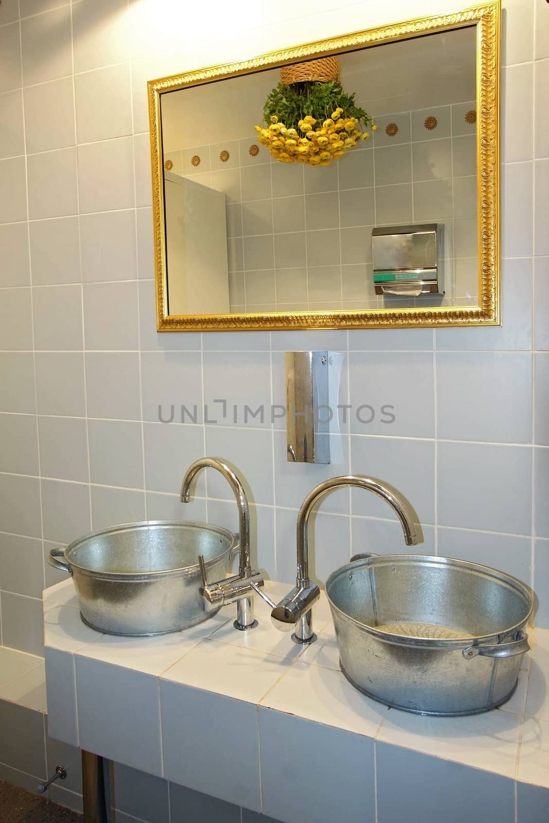 The spacious modern bathroom which has been laid out by a tile
