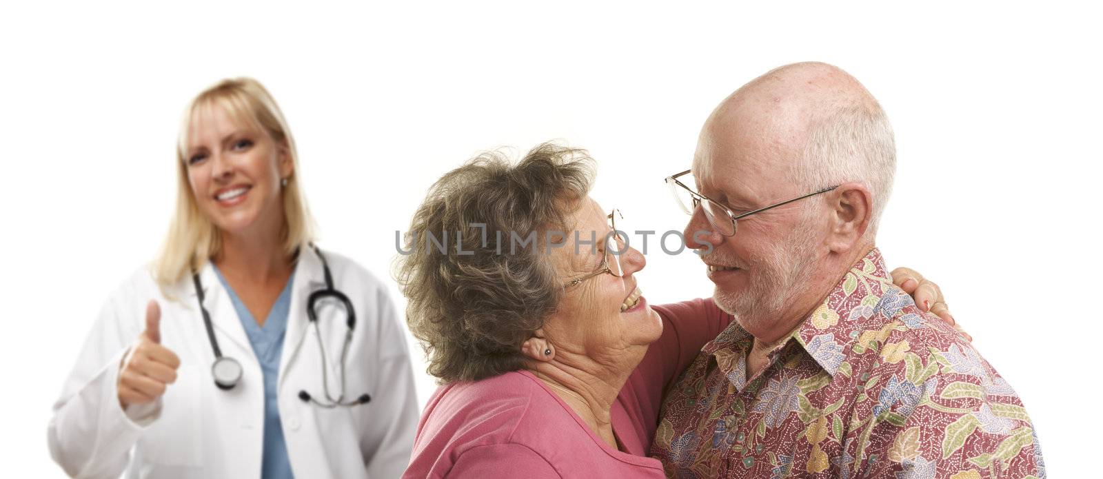 Senior Couple with Medical Doctor or Nurse with Thumbs Up Behind.