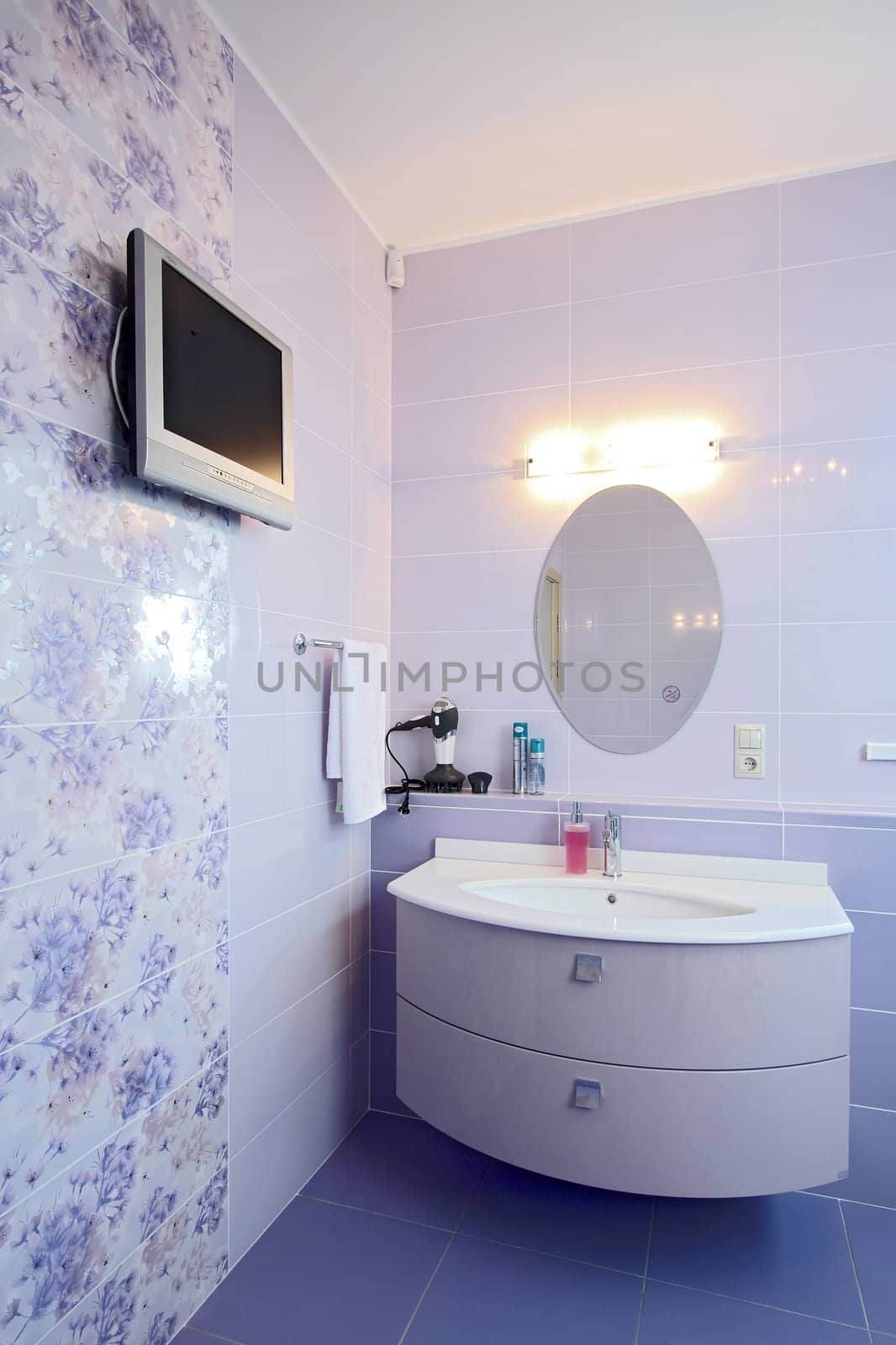 The spacious modern bathroom which has been laid out by a tile
