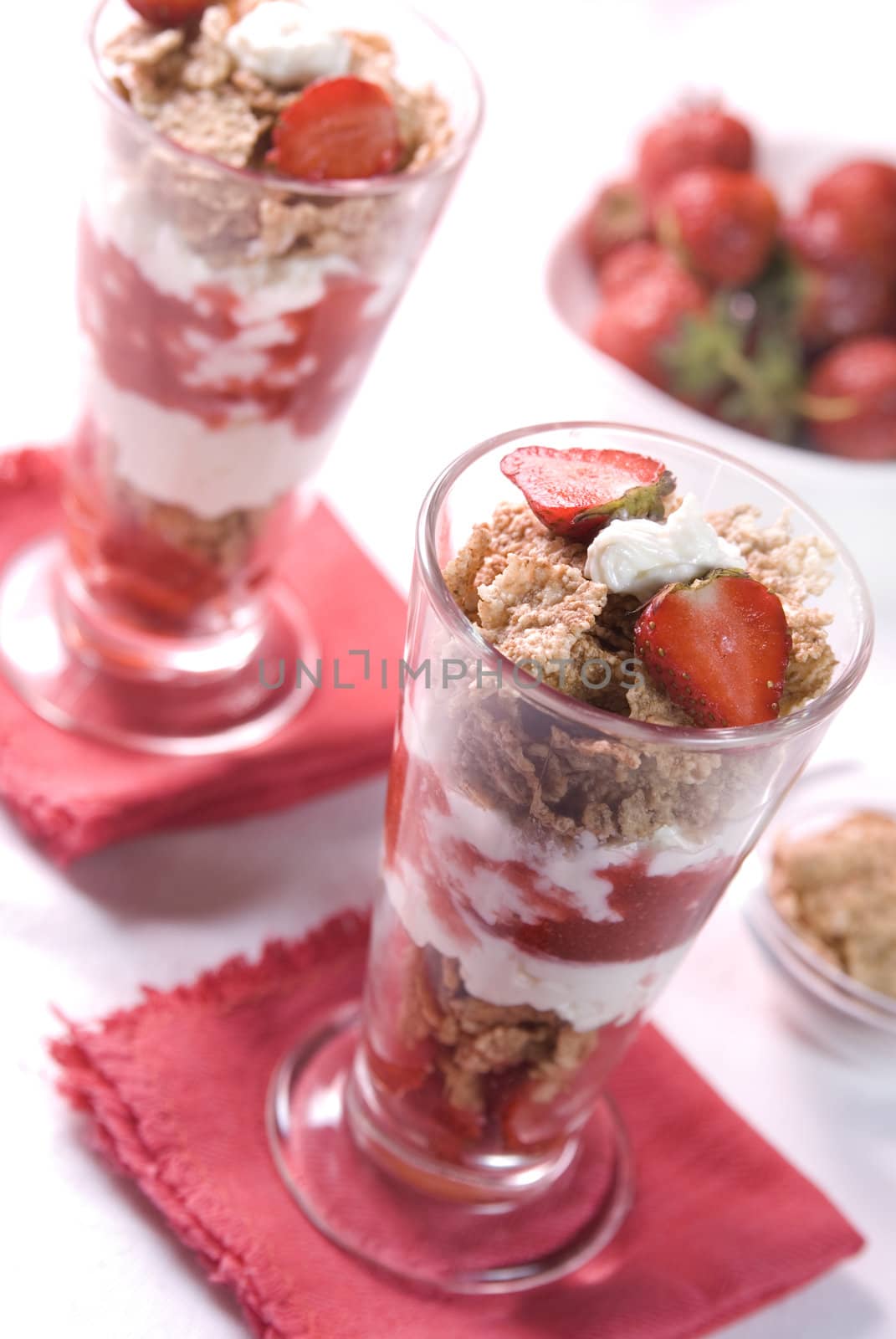 Fresh strawberries dessert with cereals, yoghurt and cream