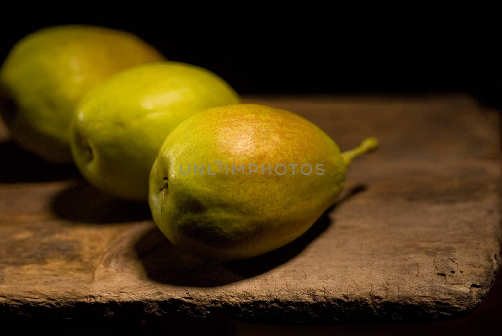 autumn fresh pears over old wood board 