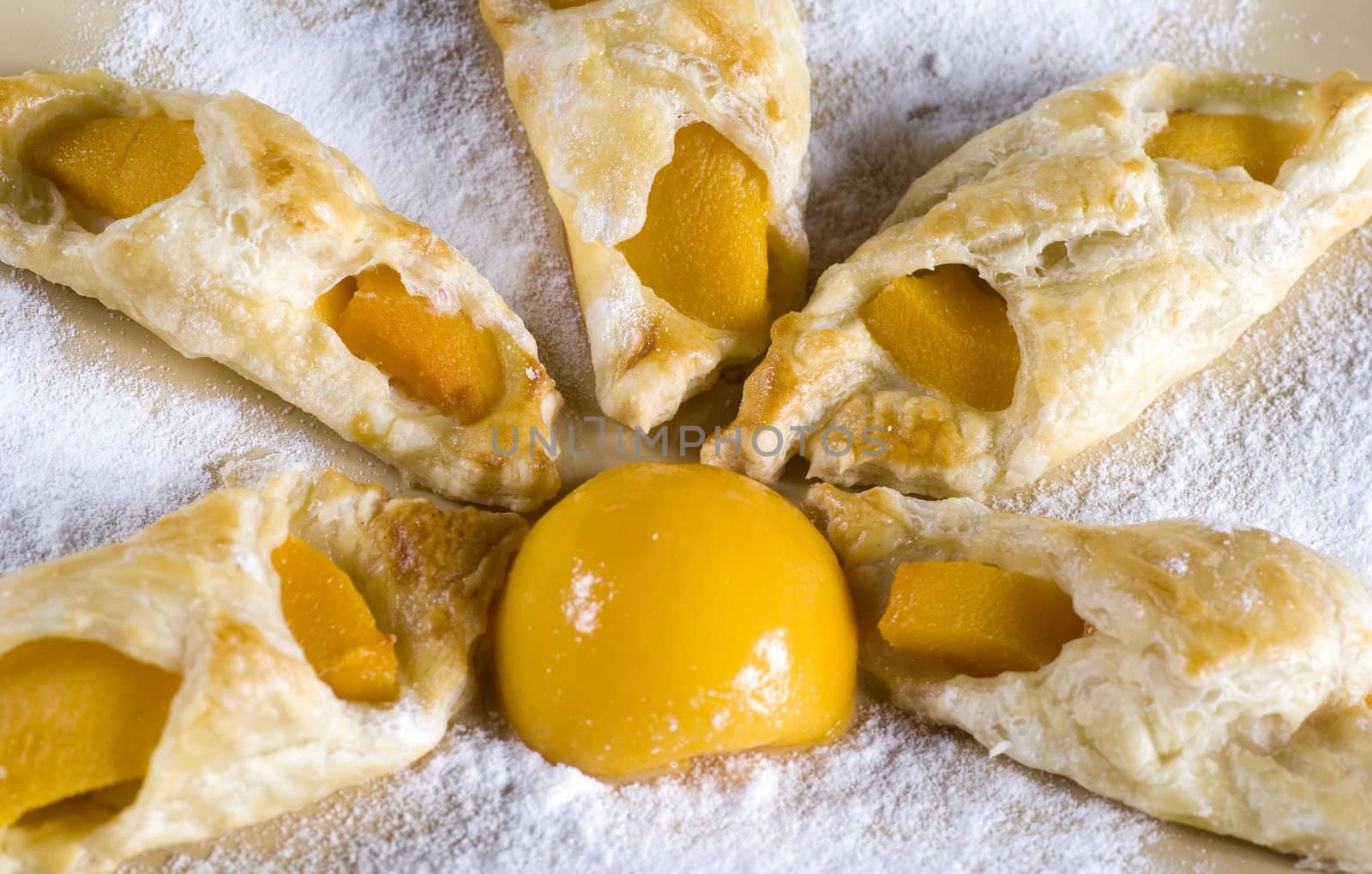 A sweet puff pastry peach on a plate 