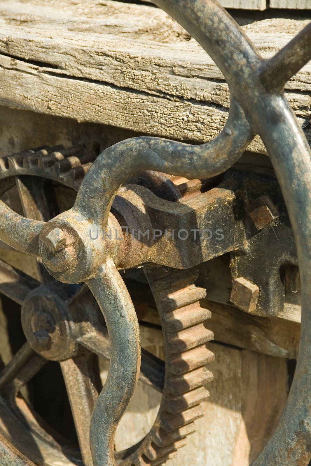 Fragment of an ancient mechanism, subjected to environmental influences, from iron and wood