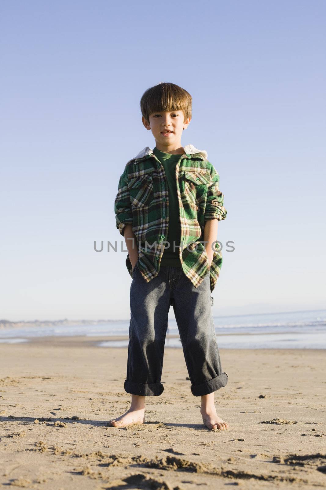 Portrait of a Little Boy Standing at The Beach