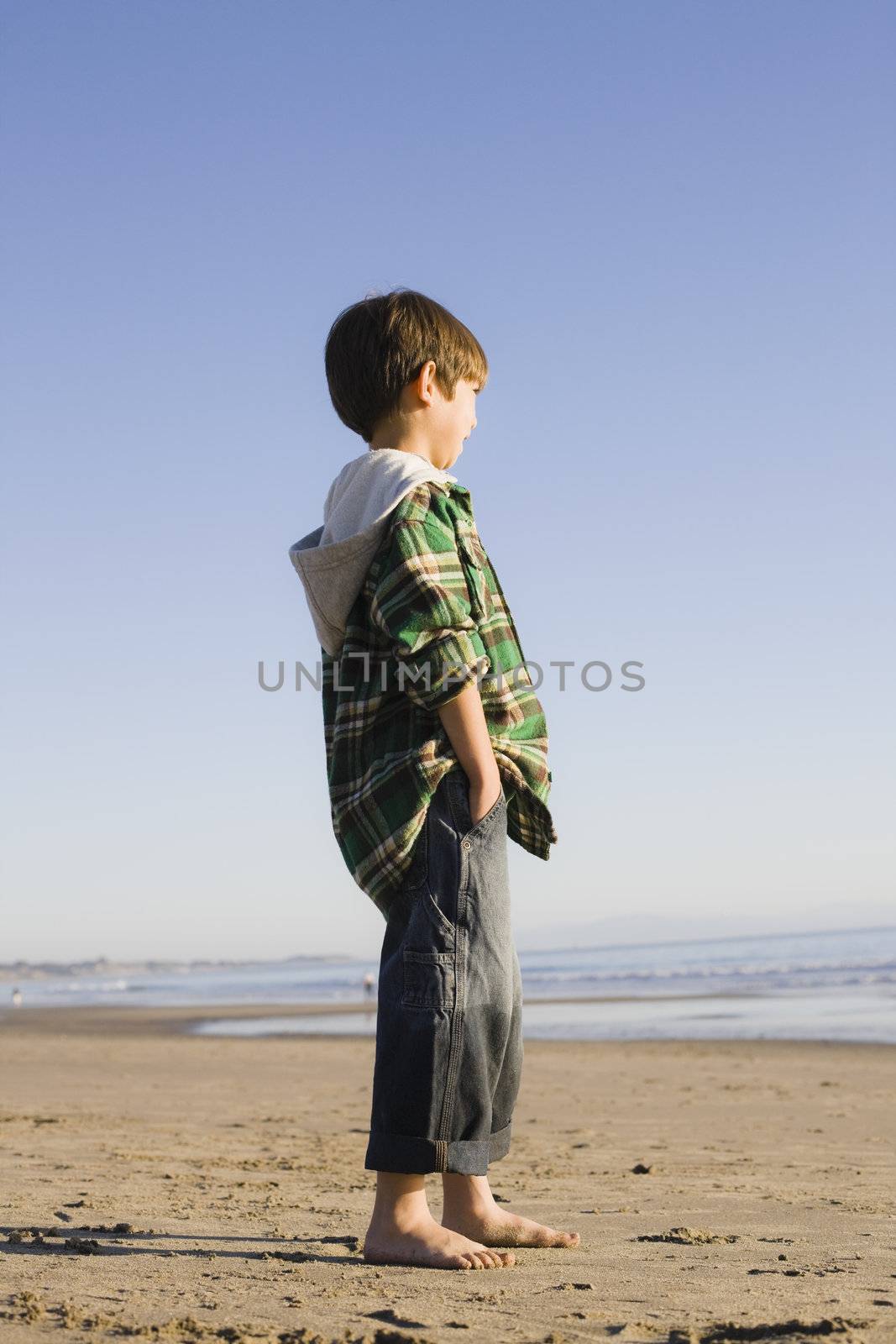 Portrait of a Little Boy Standing at The Beach