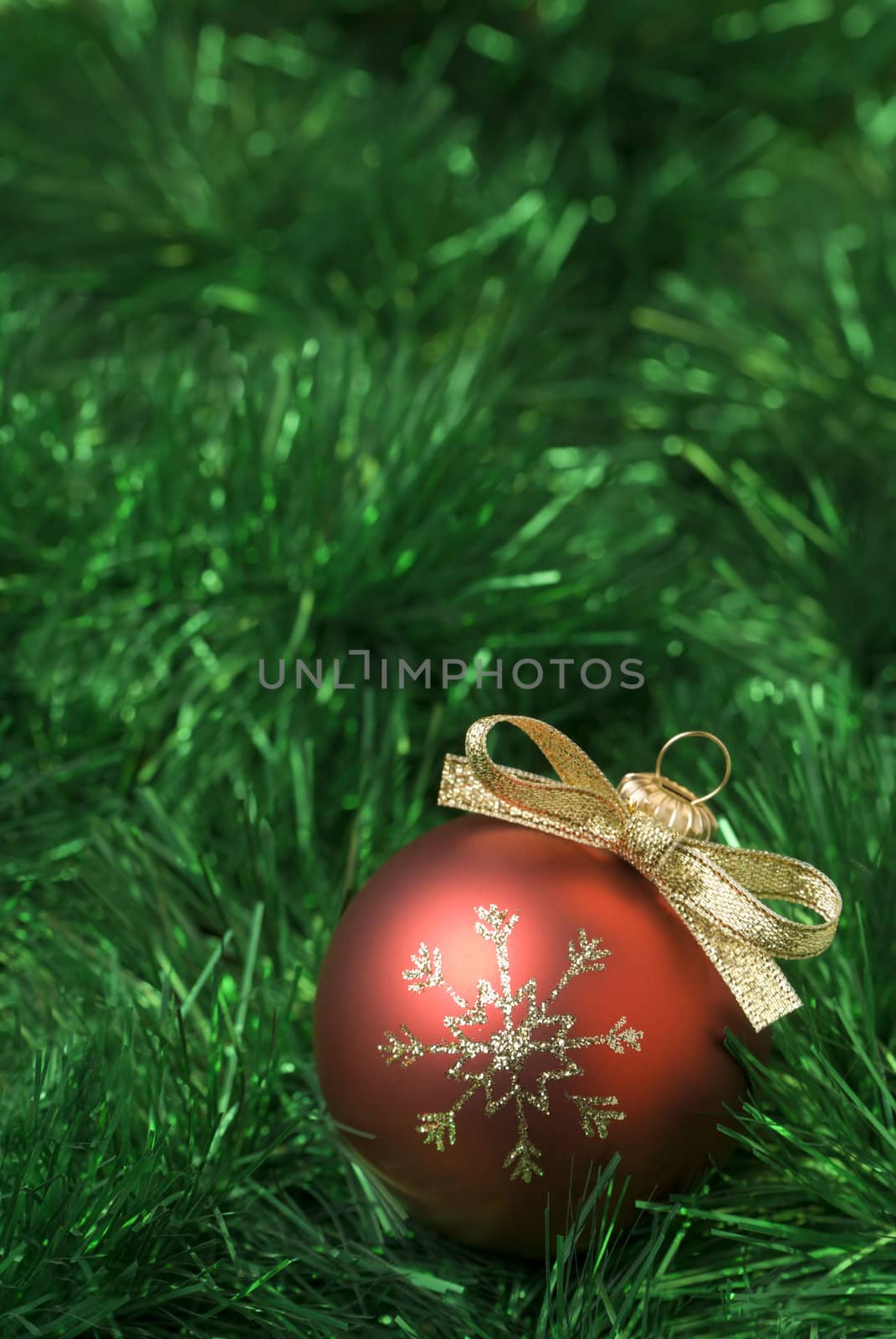 Red christmas balls on the green tinsel. aRGB.