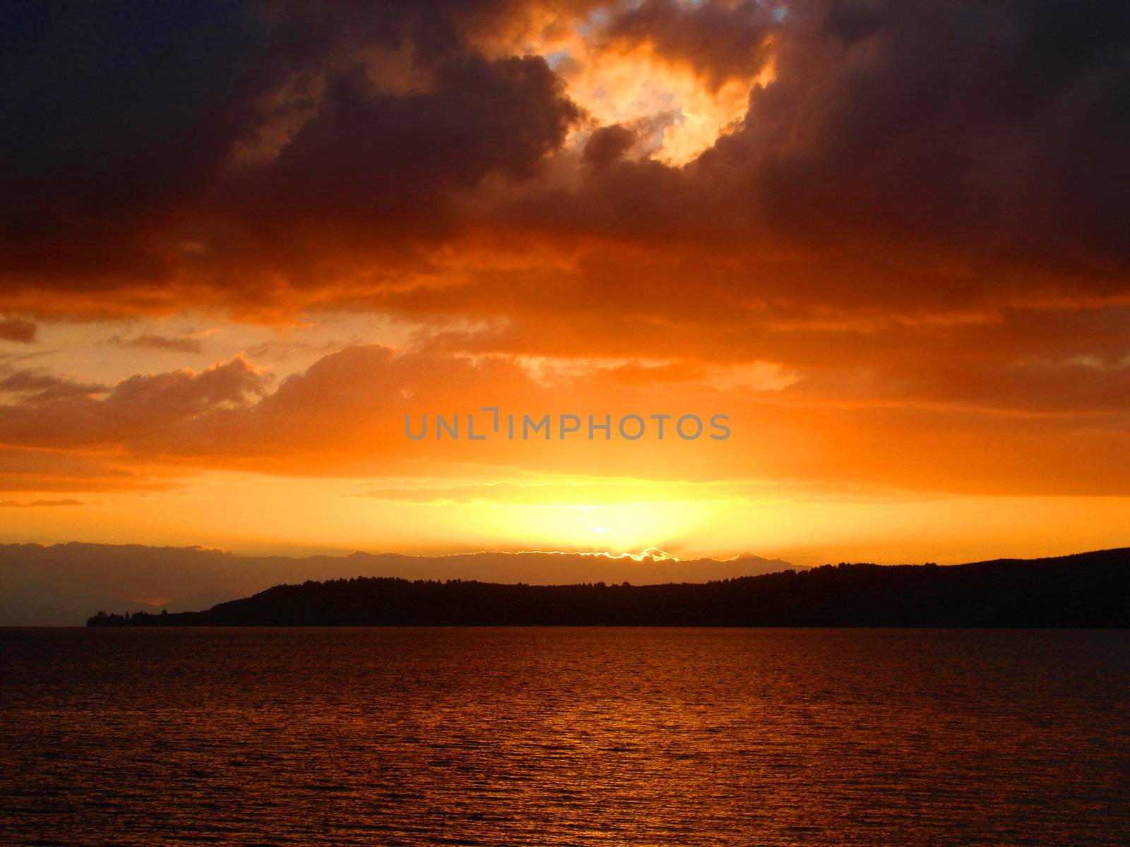 Firey Sunset over Lake Taupo, New Zealand by Cloudia