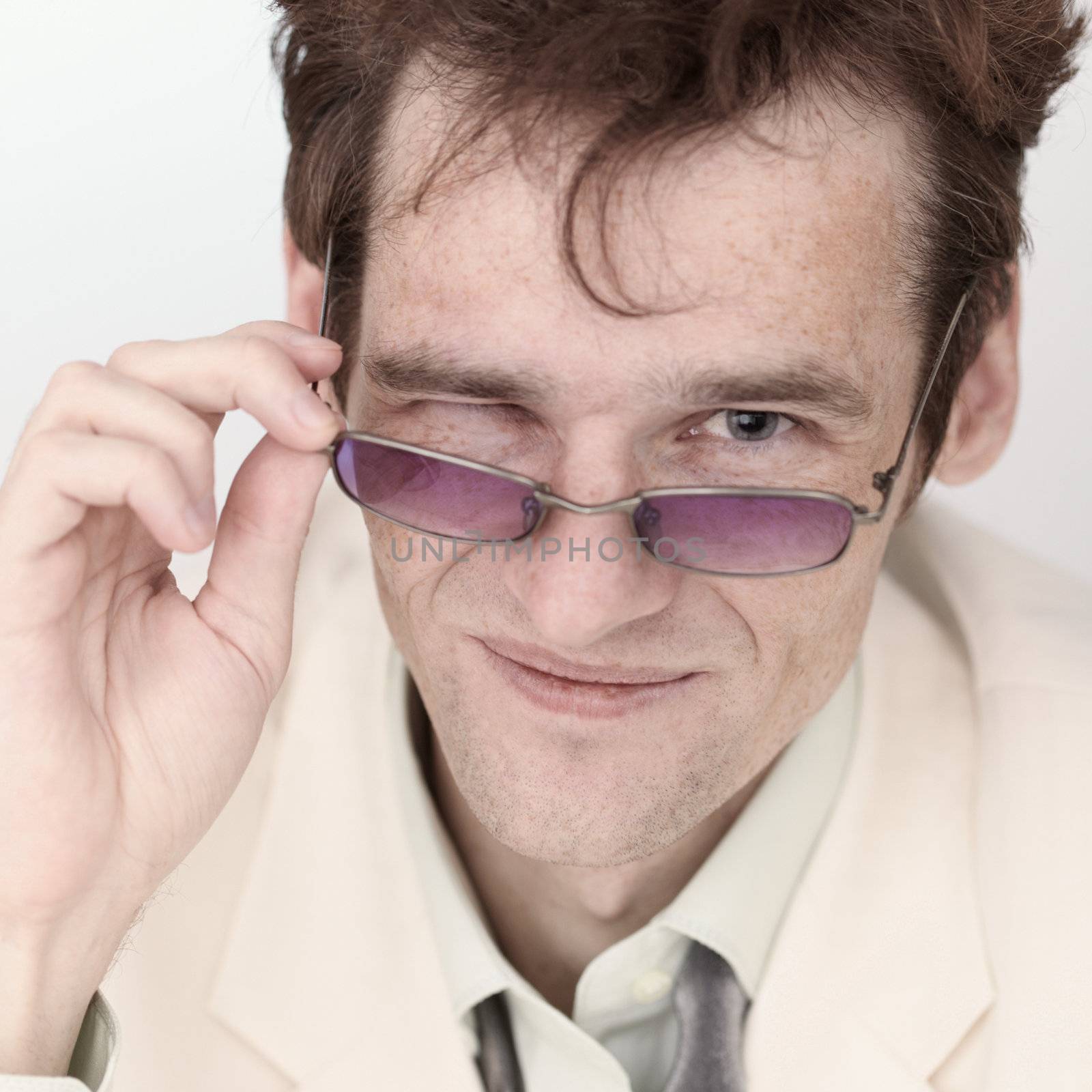 Amusing portrait of the artful man with spectacles close up