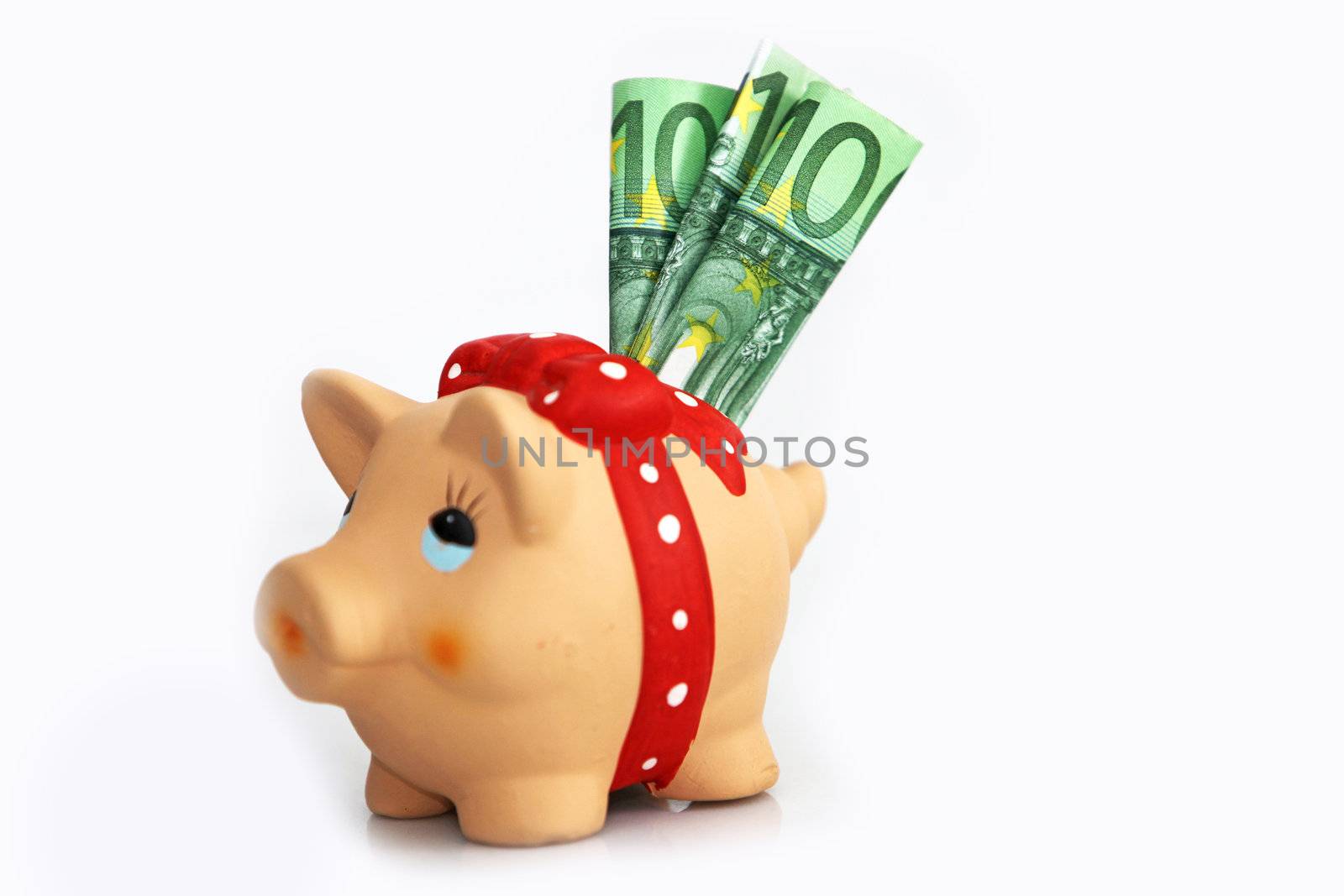 a piggy bank with three $ 100 bills - 