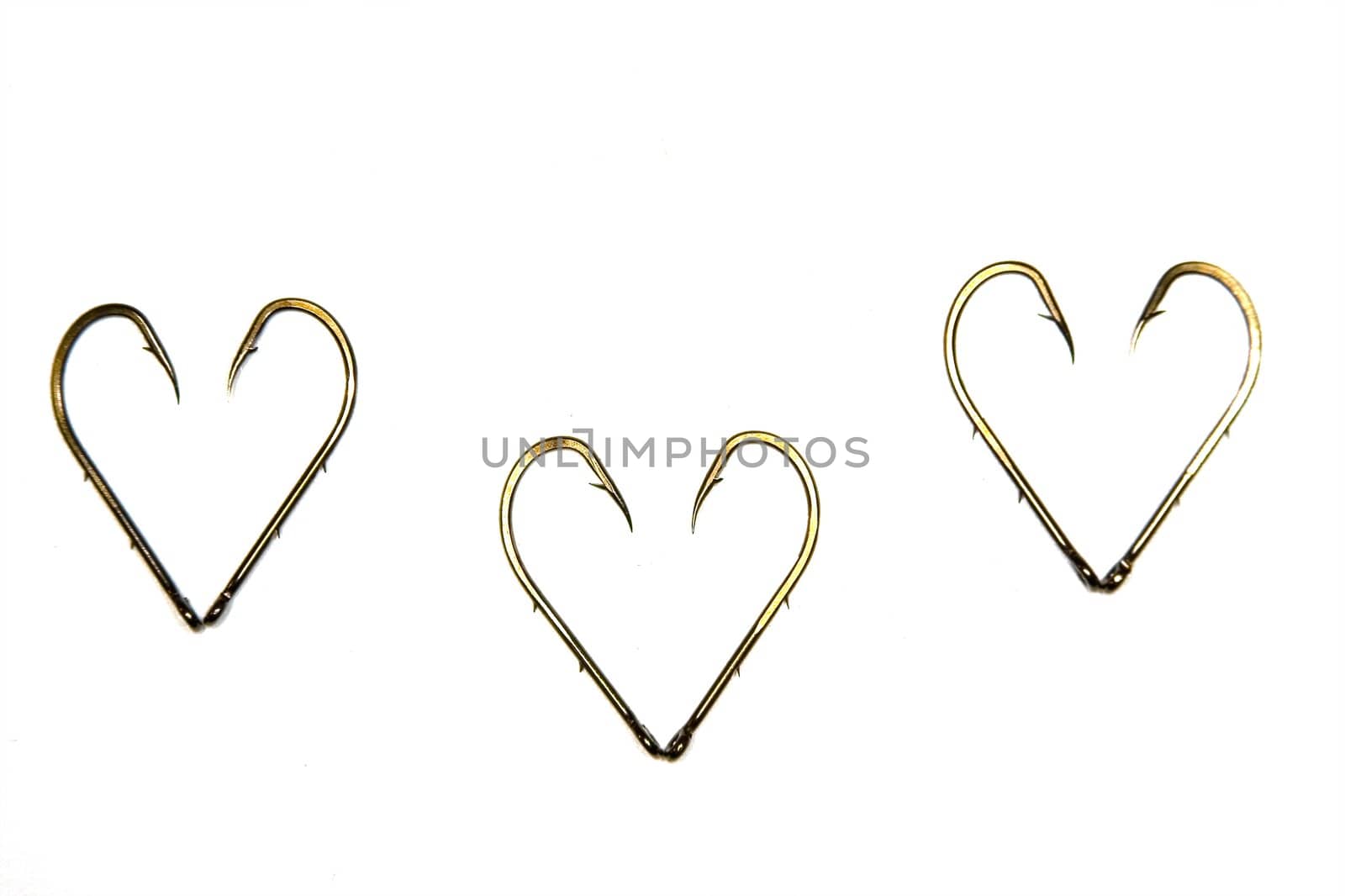 The anodized steel fishing hooks on a white background