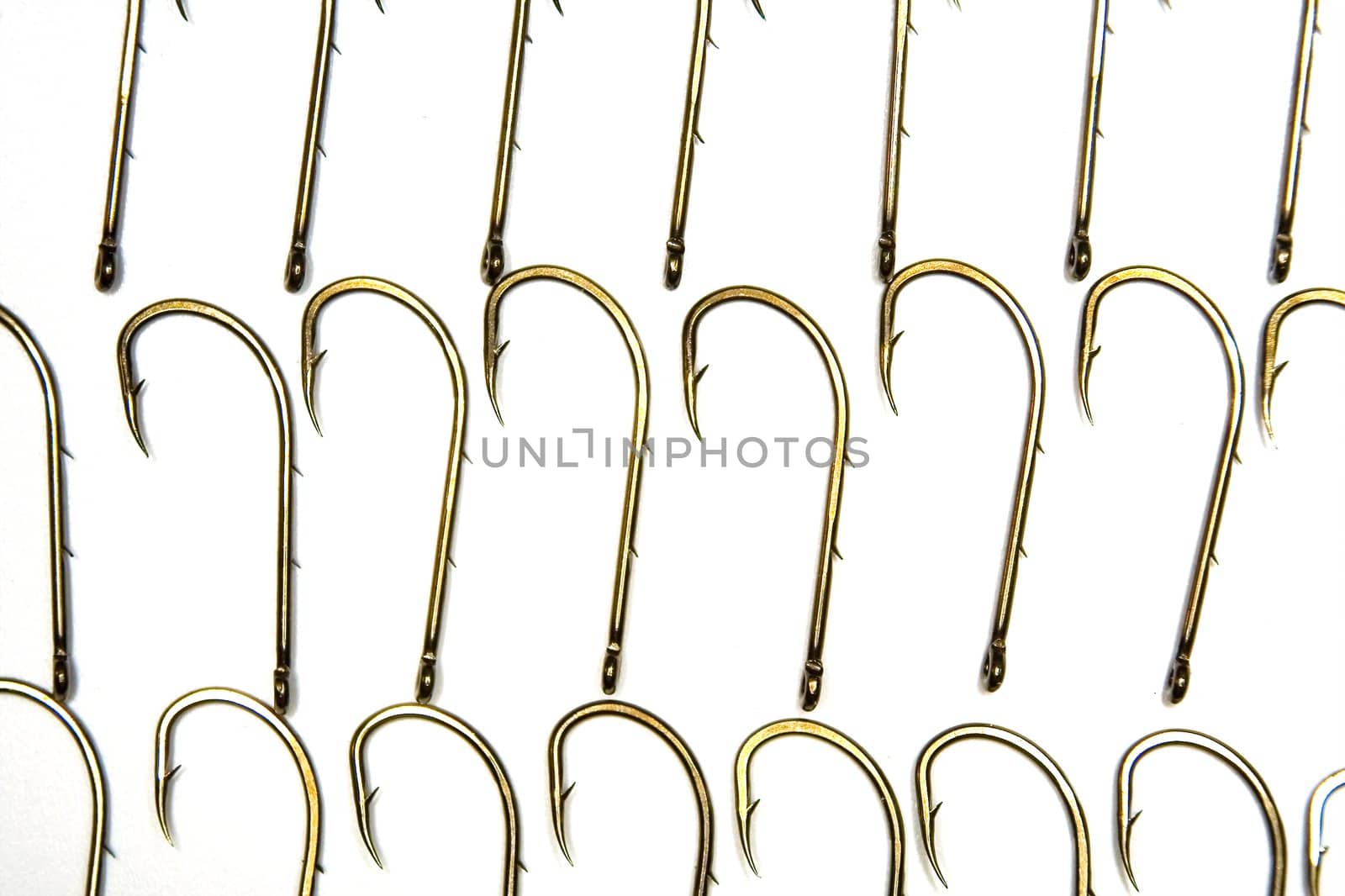 The anodized steel fishing hooks on a white background