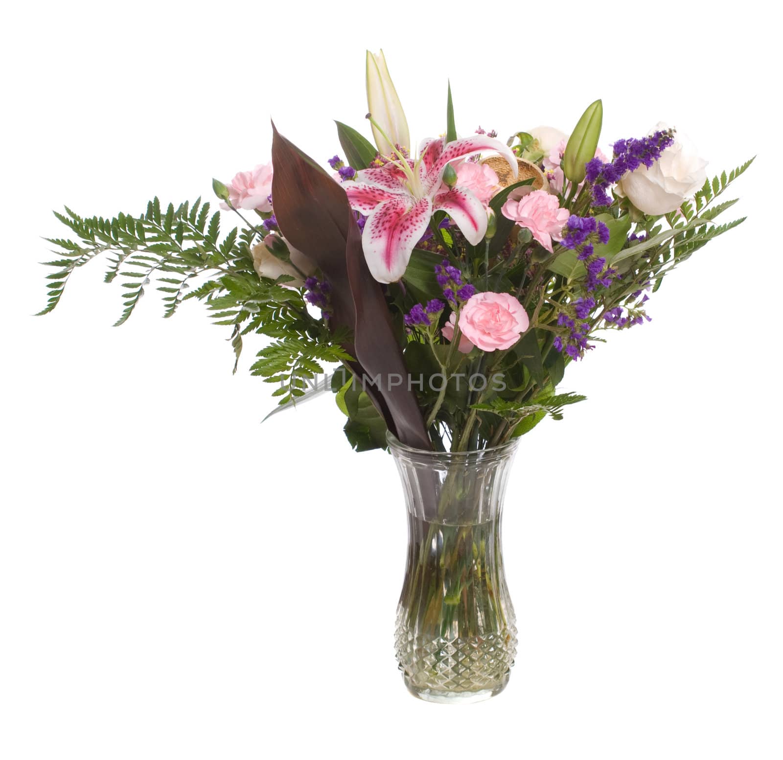 A bouquet of flowers inside a vase, isolated against a white background.