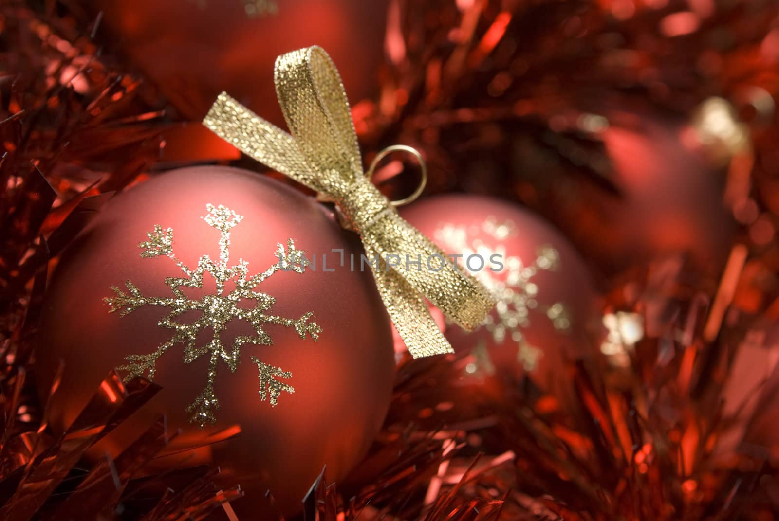 Red christmas ball on the tinsel. aRGB.