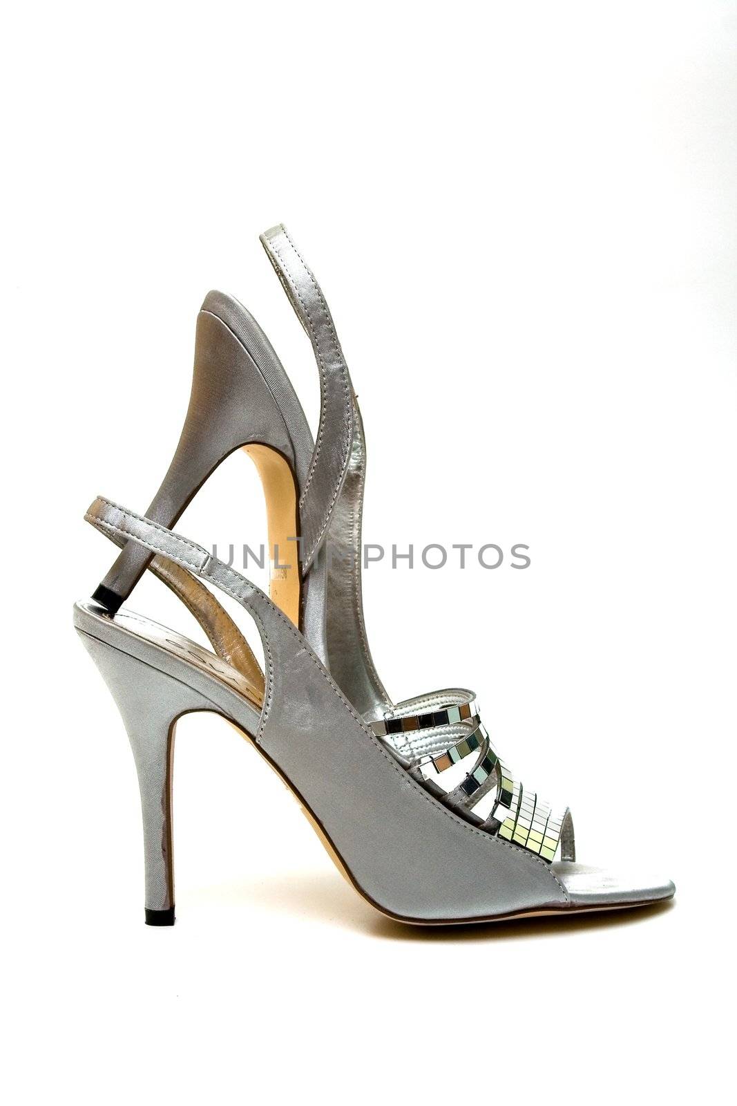 Elegant female shoes with a high heel on a white background
