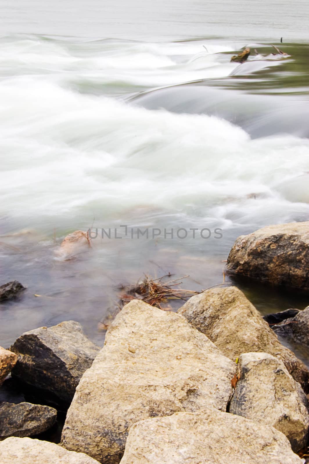 Waterfall movement and rocky shore