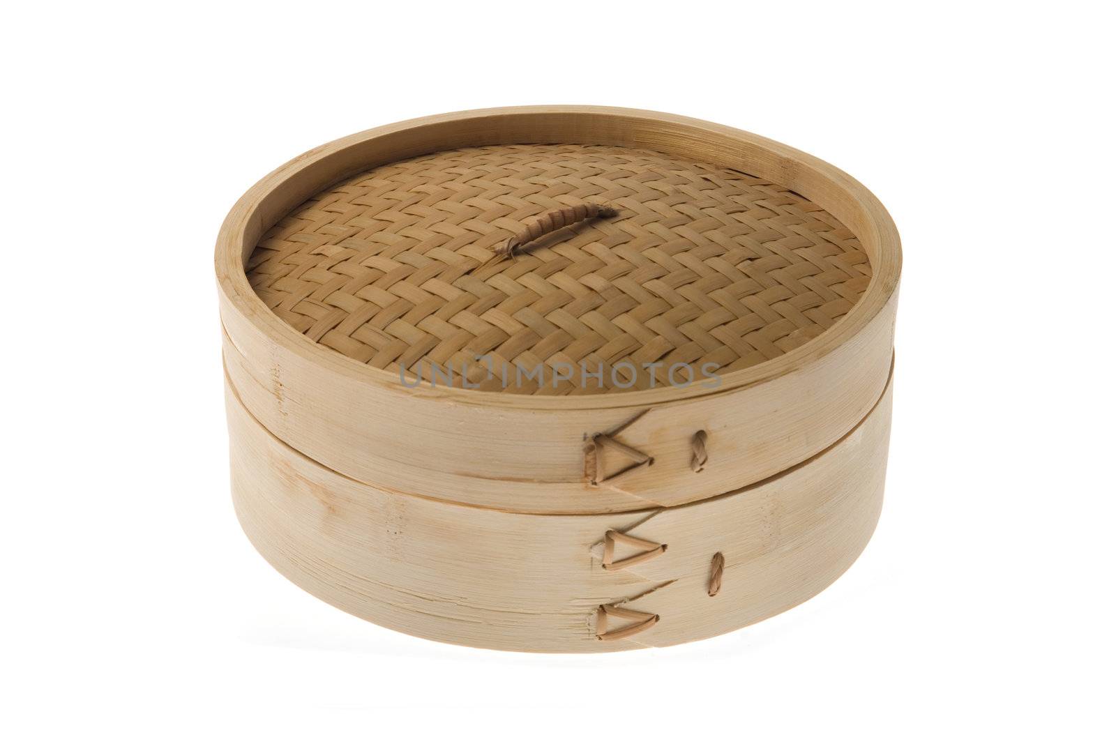 Bamboo steamer isolated over a white background.