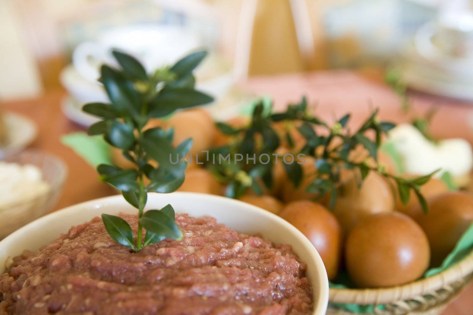 steak tatar - minced meat with eggs, onion, salt and pepper on easter table