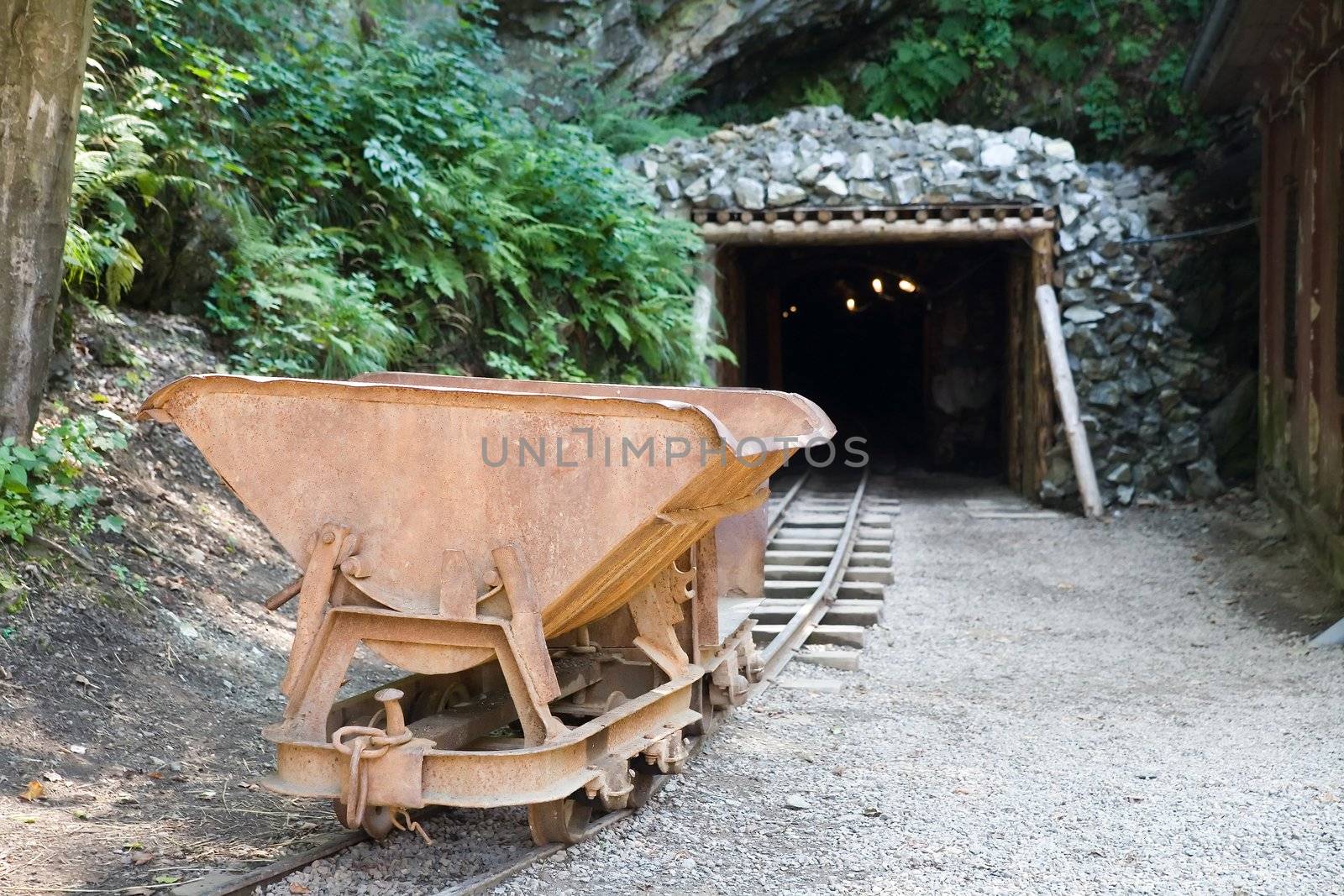 mine trolley standing in front of the old gold mine