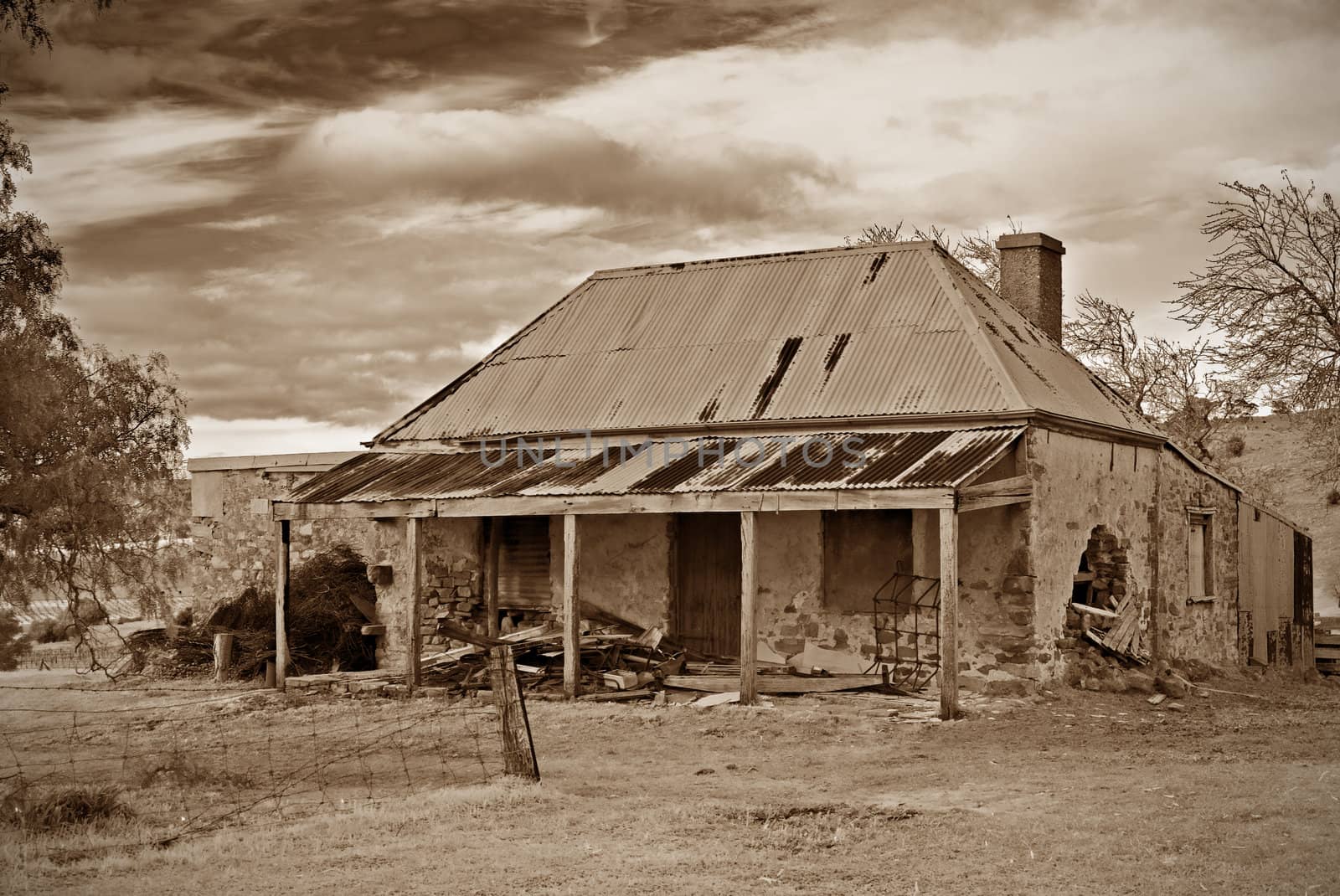 old farmhouse ruins in sepia by clearviewstock