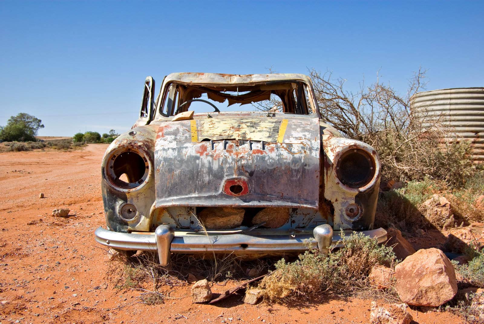 old rusty car in the desert 