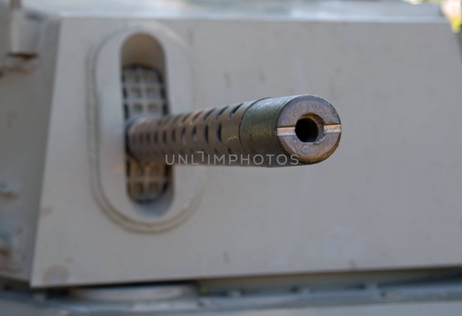 looking down the barrel of a gun on an old tank