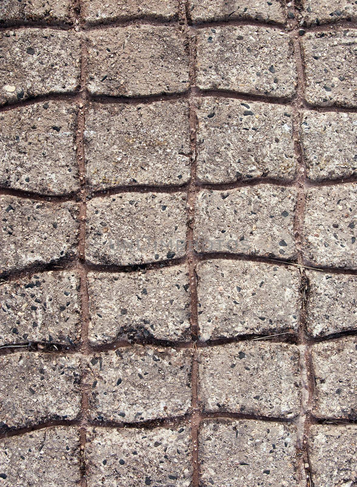 concrete with paved or cobblestone pattern in it