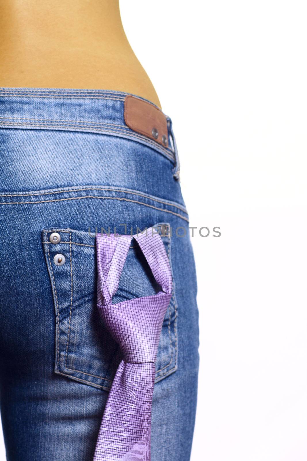 The girl in jeans with the fastened tie in a pocket removed from a back