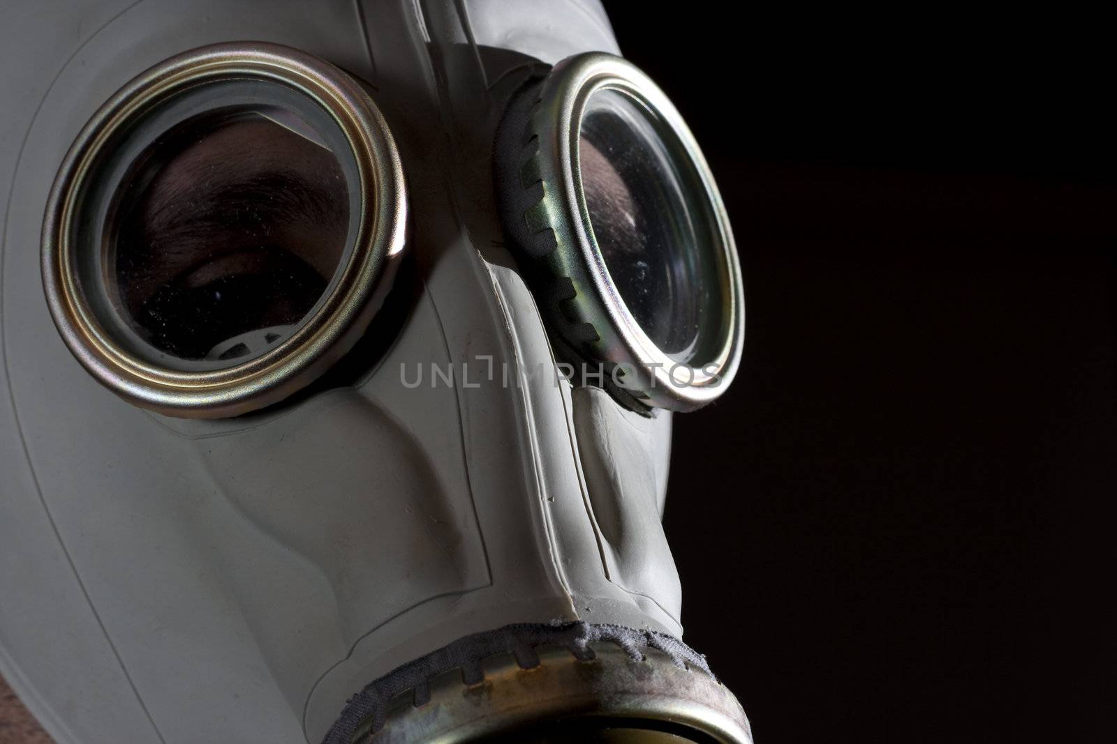 a man wearing a gas mask environment danger concept image