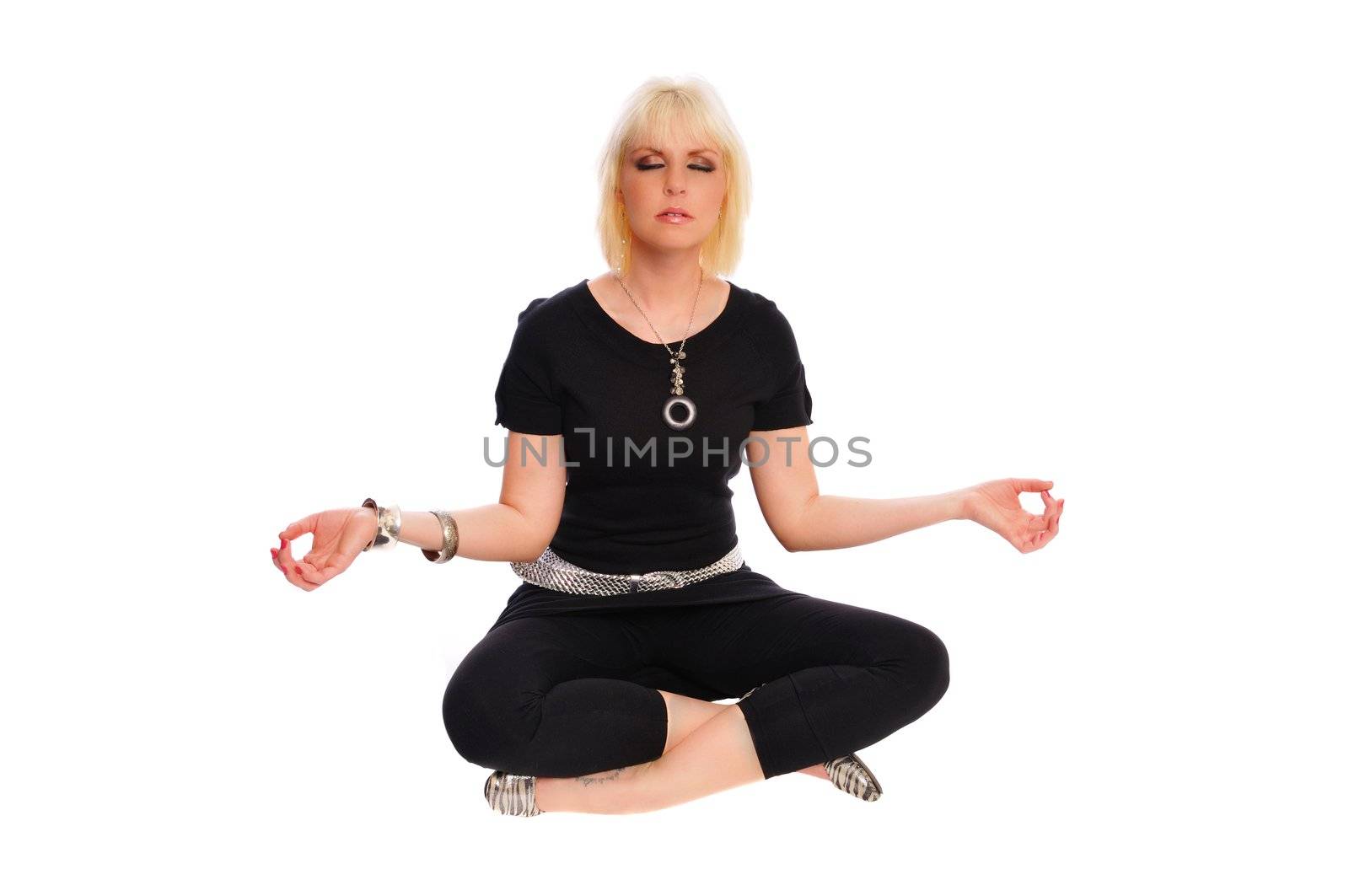 attracticve blonde woman meditating on a white background