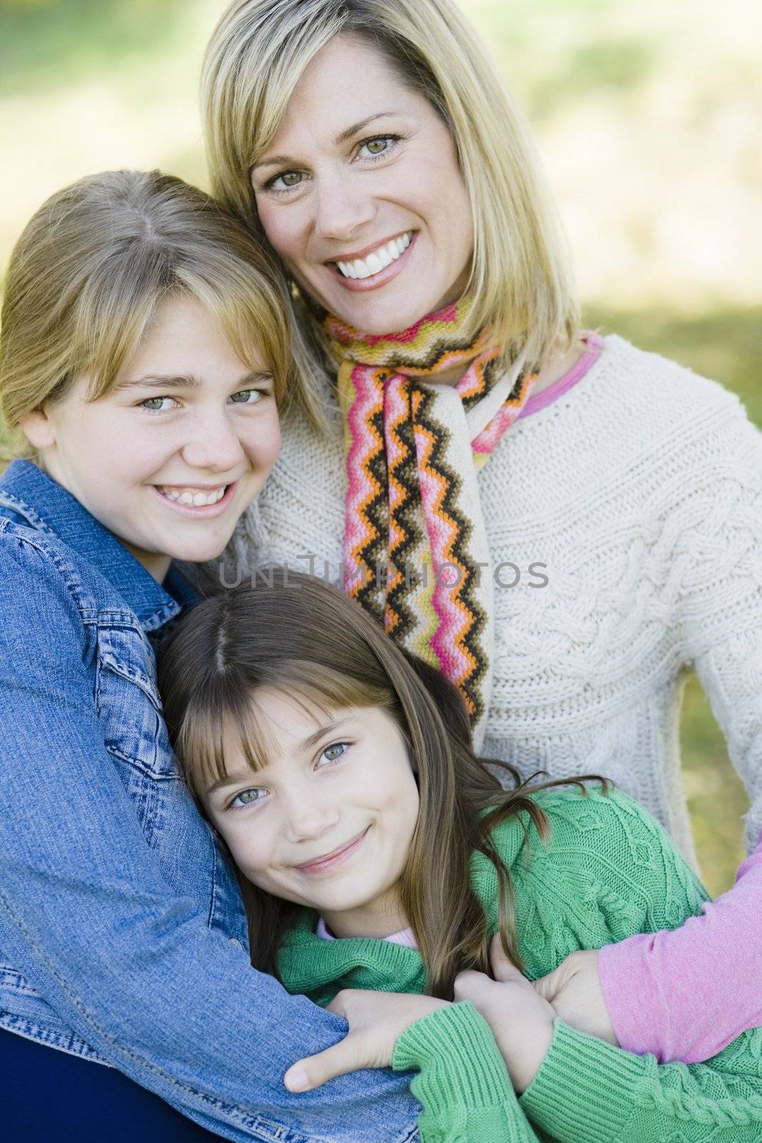 Portrait of a Mother and Daughters  Together in a Park