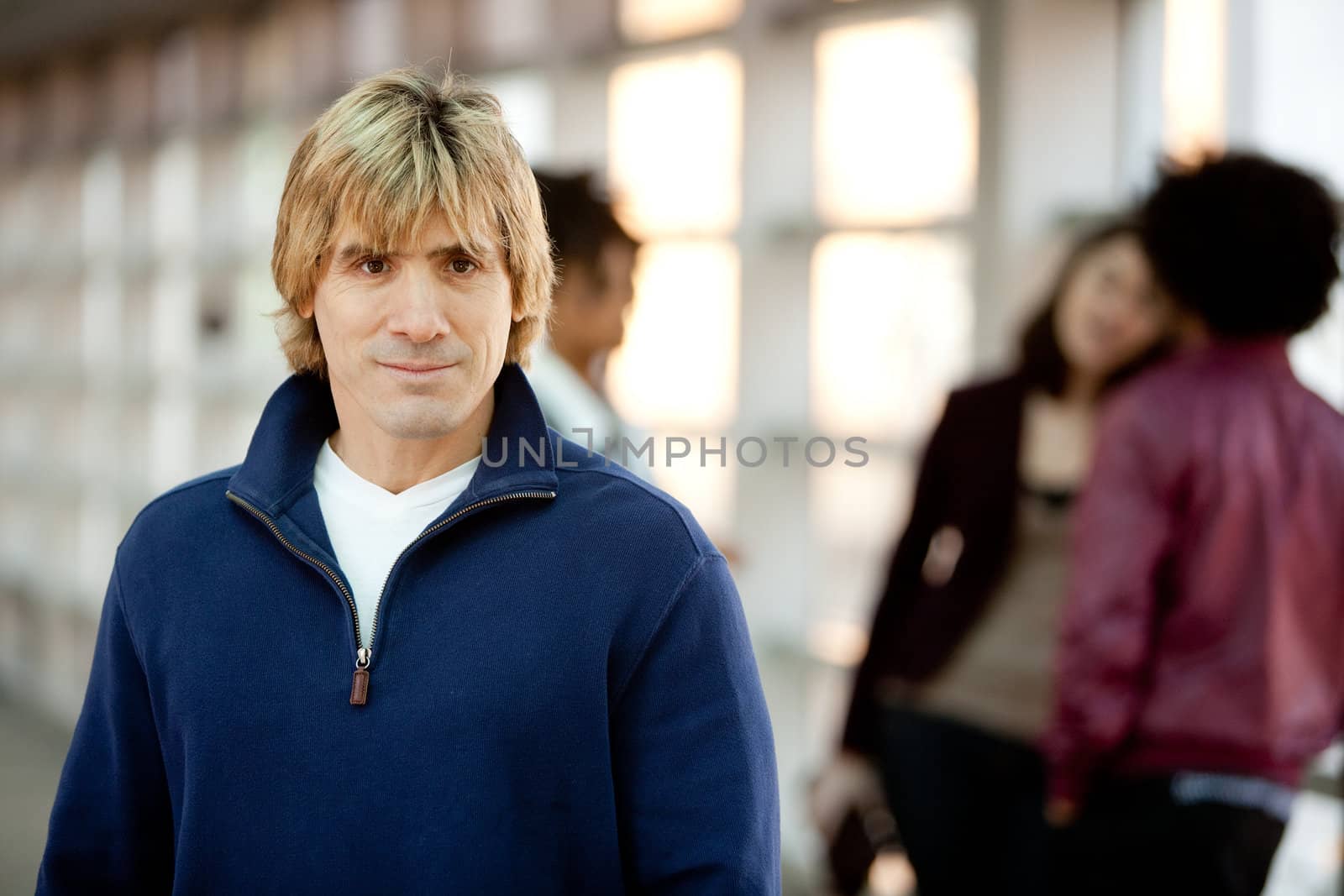 A portrait of a happy with with friends in the background