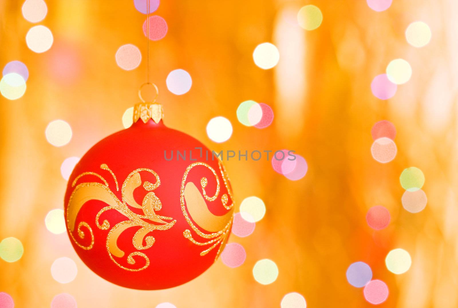 Christmas ornaments over gold blurred background by rozhenyuk