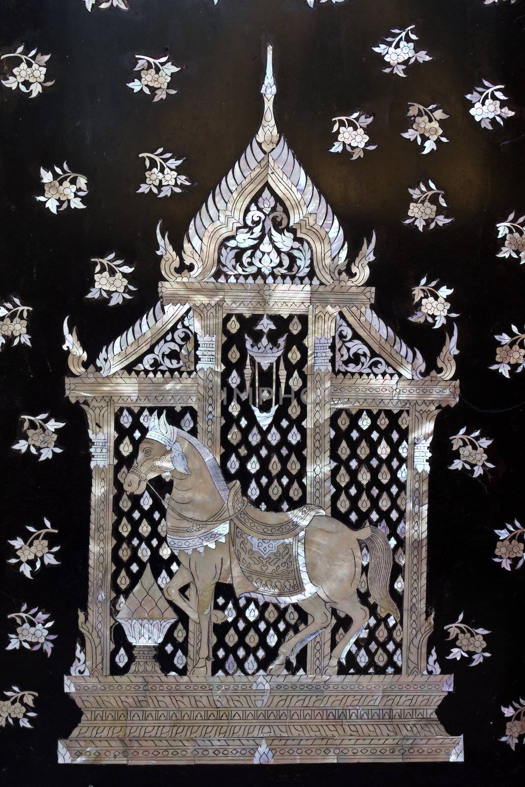 Traditional Thai style church door art, decorated with pieces oyster shell