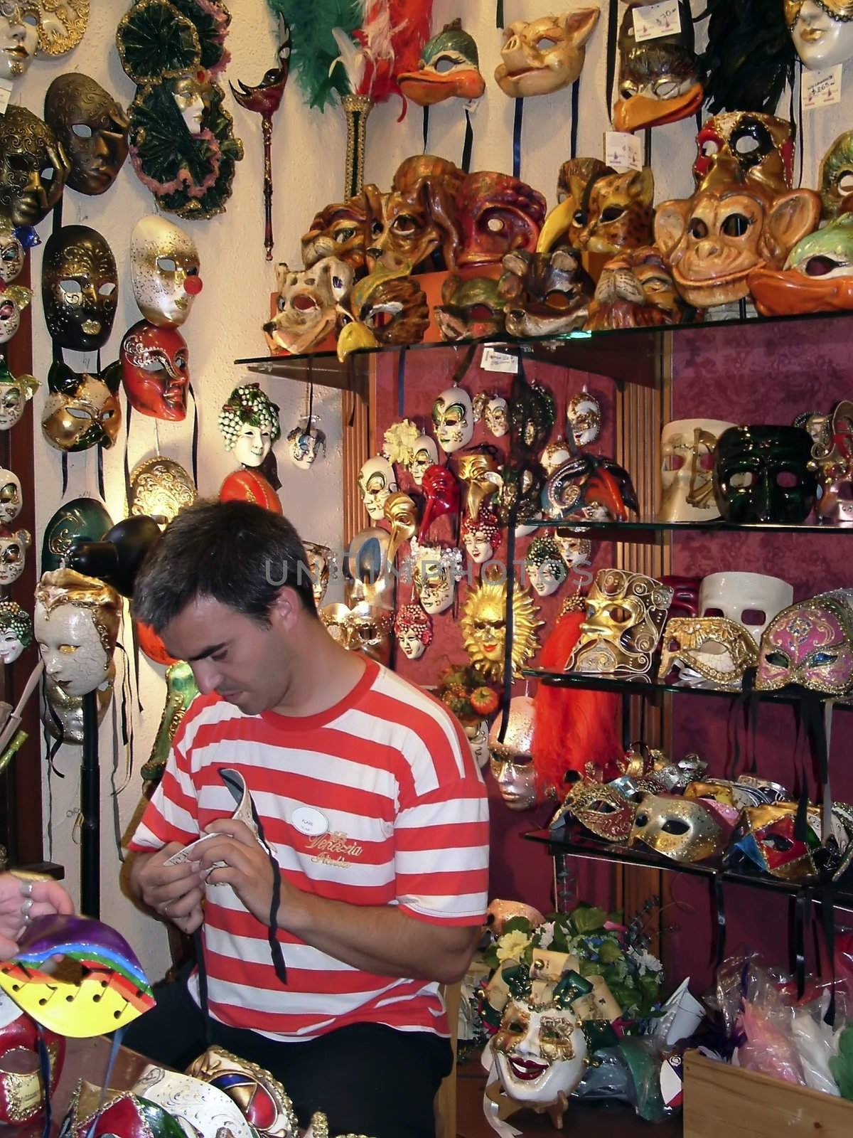 Man in the process of handcrafting Venetian carnival masks