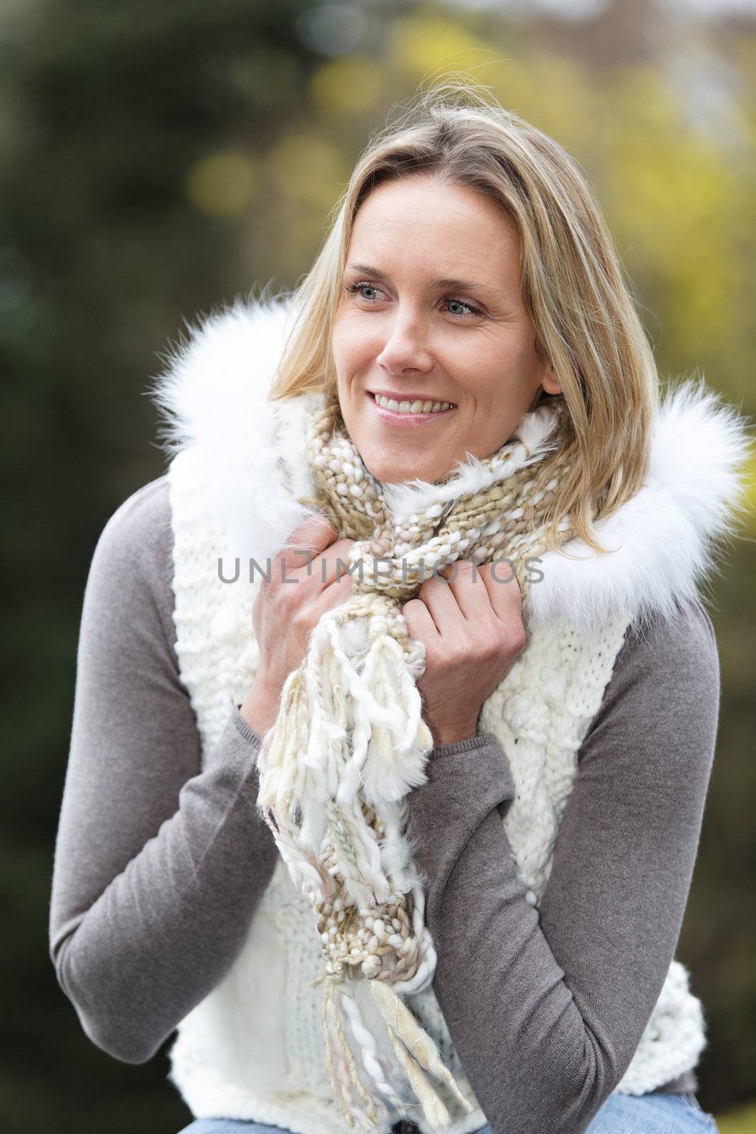 portrait of beautiful blond woman outdoor in autumn