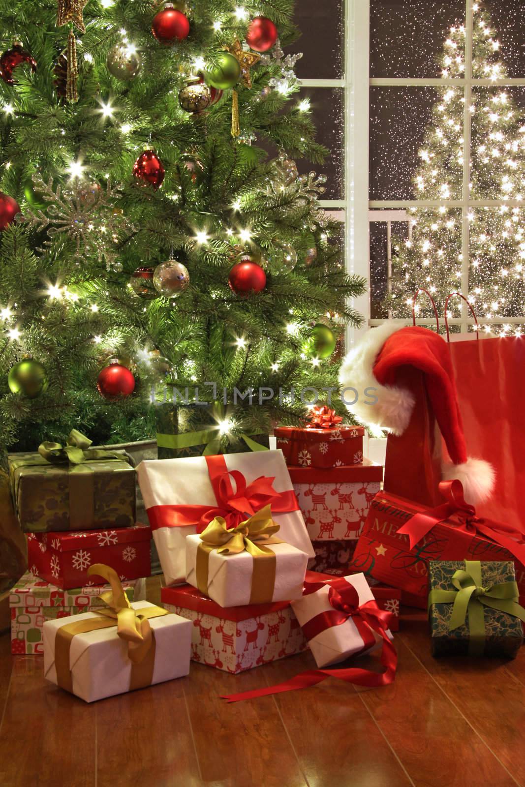 Brightly lit christmas tree with lots of gifts by Sandralise