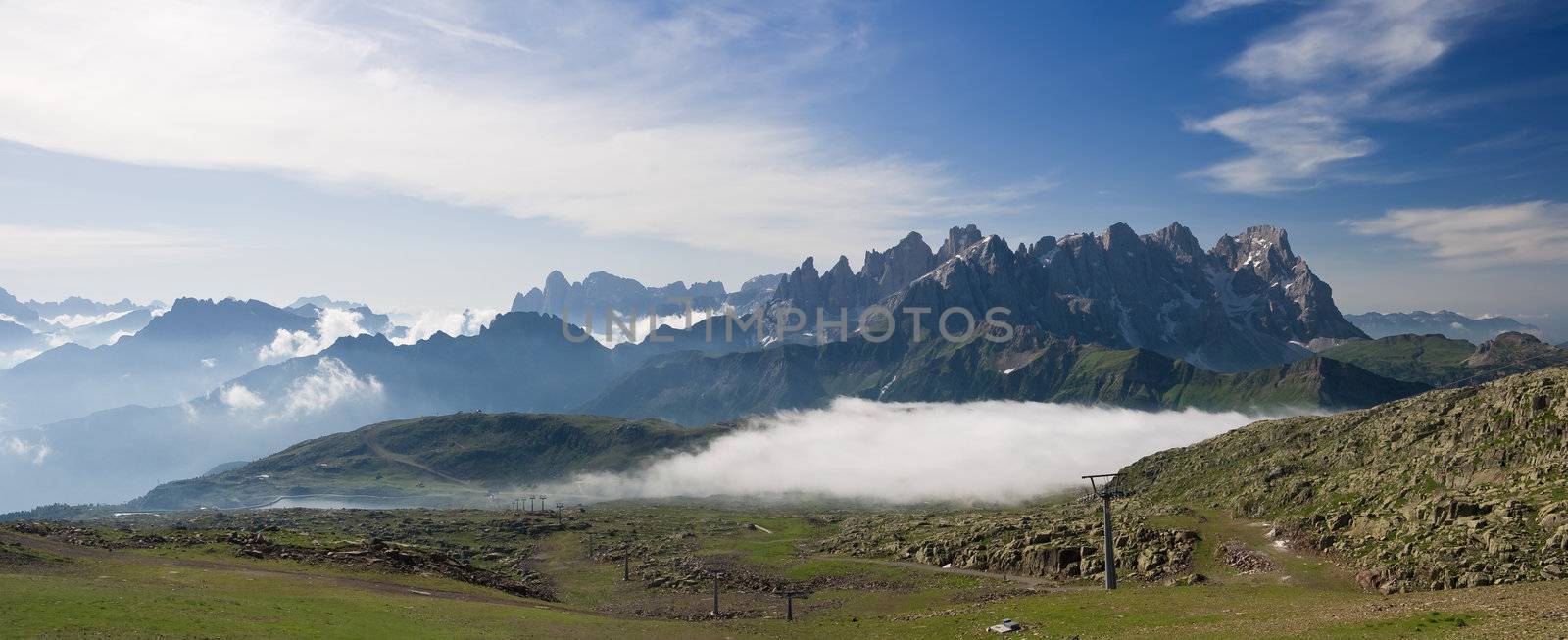 summer view of dolomites  mountain with cableway near San Pellegrino pass, Trentino, Italy. On the background Pale San Martino mountain.