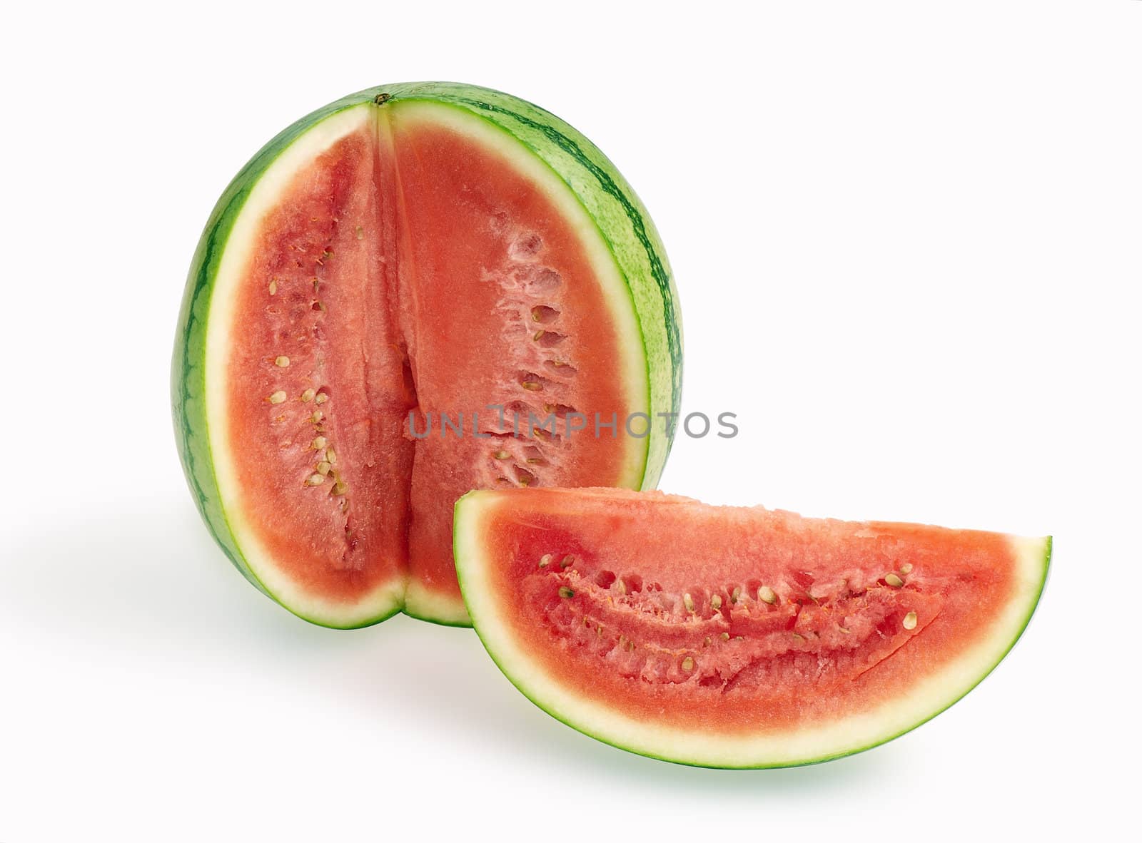 Slice of watermelon in front of whole watermelon 